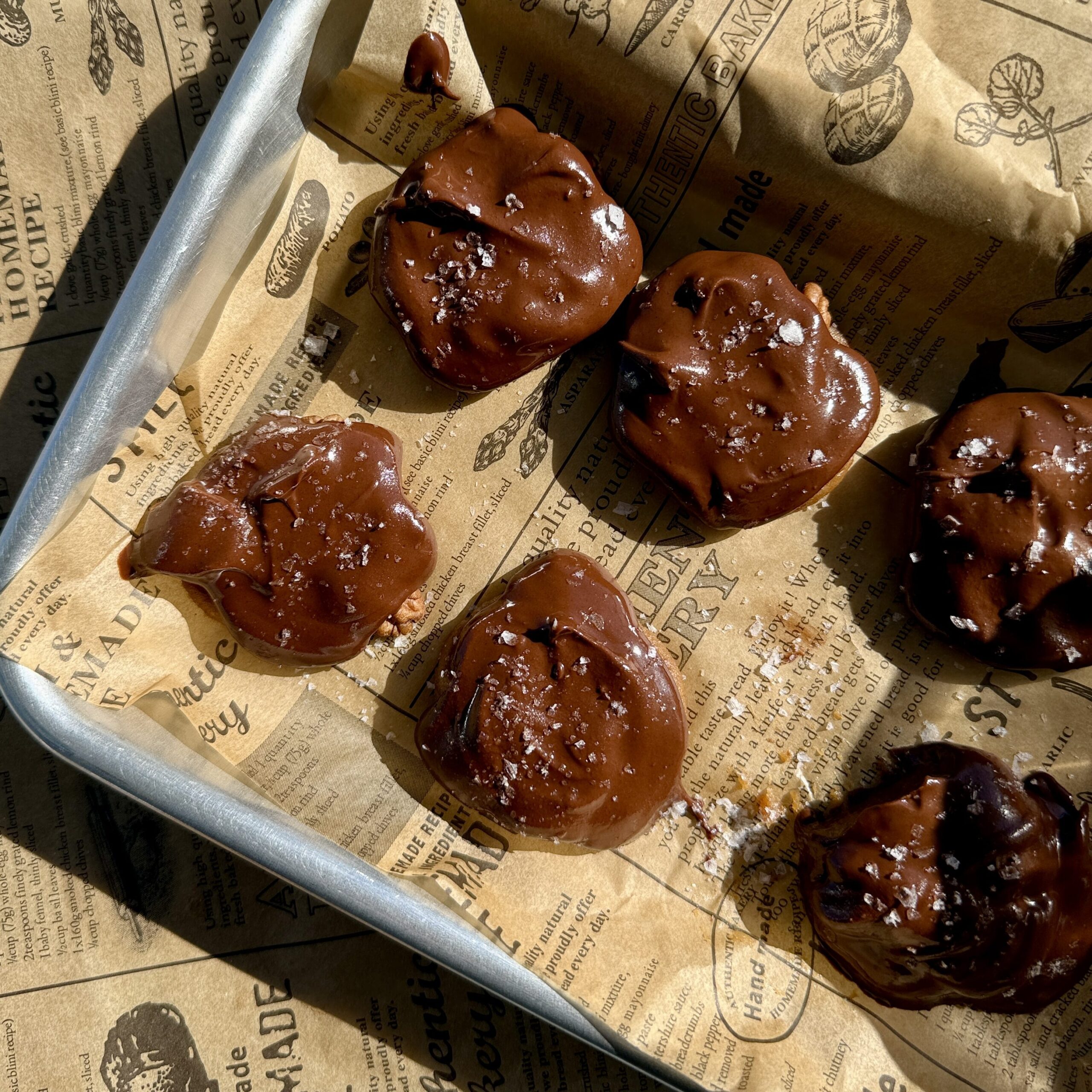 The Ultimate Clean Chocolate Turtle Recipe : chocolate turtles sitting on parchment paper